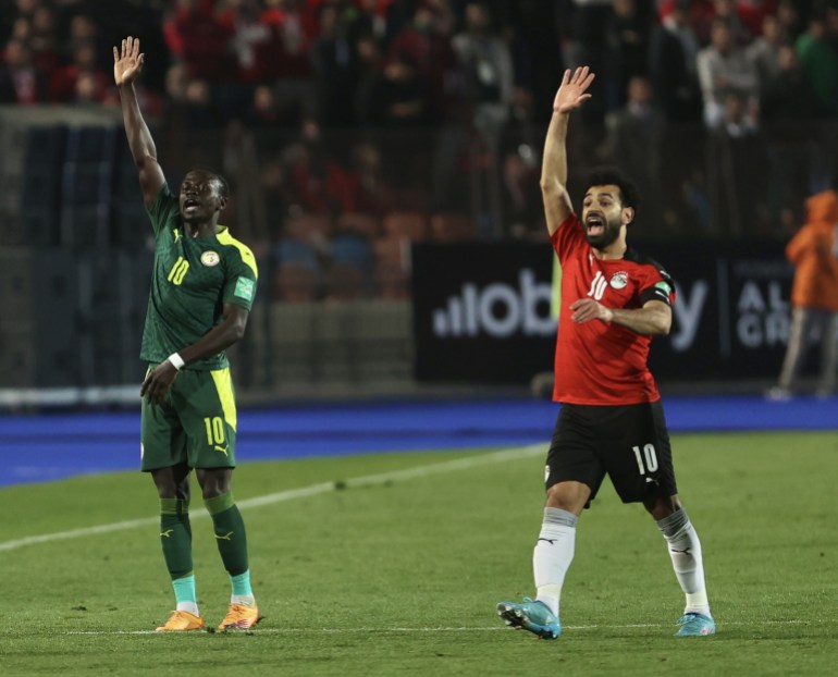 Egypt v Senegal - FIFA World Cup African Qualifiers Egypt v Senegal - FIFA World Cup African Qualifiers- - CAIRO, EGYPT - MARCH 25: Mohamed Salah (R) of Egypt in action against Sadio Mane of Senegal during FIFA World Cup African Qualifiers 3rd round match between Egypt and Senegal at International Cairo Stadium in Cairo, Egypt on March 25, 2022.