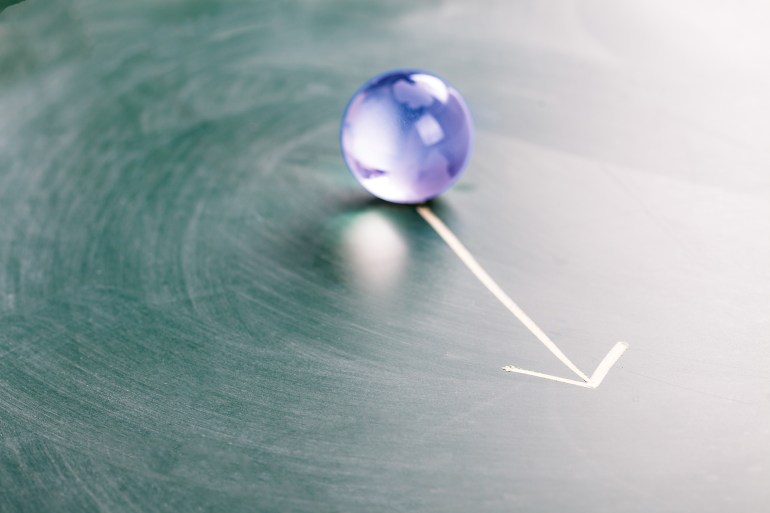 direction on a chalk board with world globe crystal ball