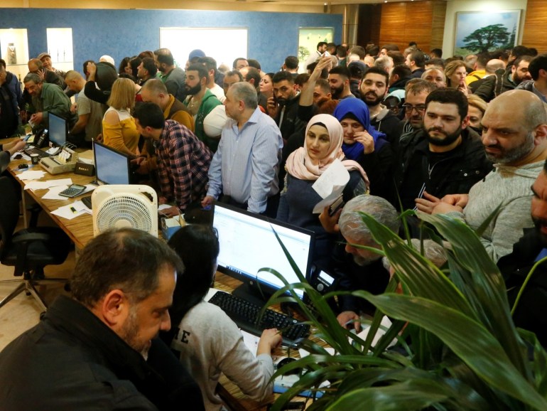 People wait to buy flight tickets at the Lebanese Middle East Airlines (MEA) offices in Beirut international airport, Lebanon February 16, 2020. REUTERS/Mohamed Azakir