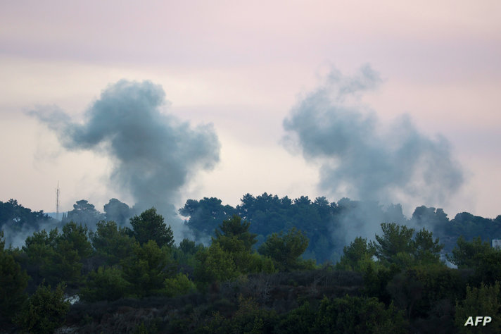 Smoke billows after an Israeli strike on the Lebanese village of Alma Ach-Chaab on October 13, 2023. - Israel shelled a border…