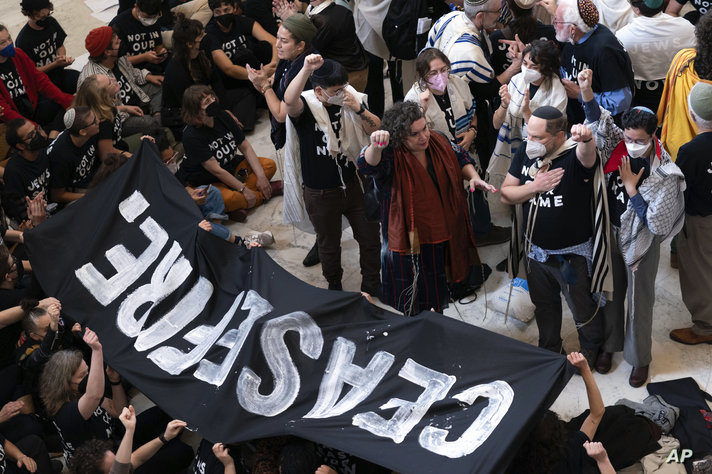 Demonstrators protest inside the Cannon House Office Building on Capitol Hill in Washington, Wednesday, Oct. 18, 2023. (AP…