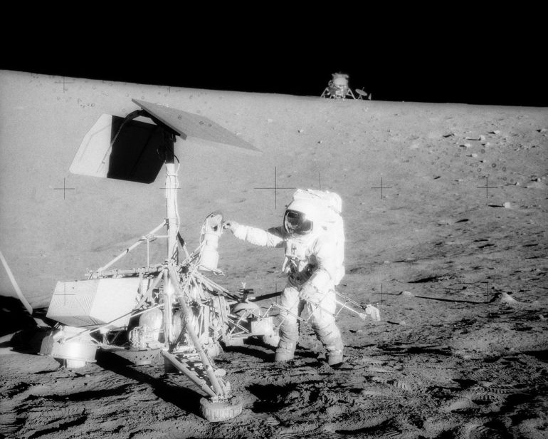 This unusual photograph, taken during the second Apollo 12 extravehicular activity (EVA), shows two U.S. spacecraft on the surface of the Moon. The Apollo 12 Lunar Module (LM) is in the background. The unmanned Surveyor 3 spacecraft is in the foreground. Credit: NASA