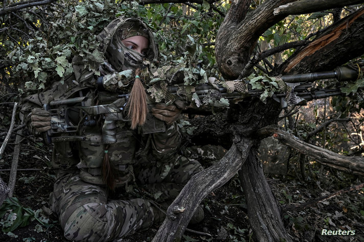 FILE PHOTO: A sniper of Ukraine's 3rd Separate Assault Brigade takes a position during a reconnaissance mission near Bakhmut