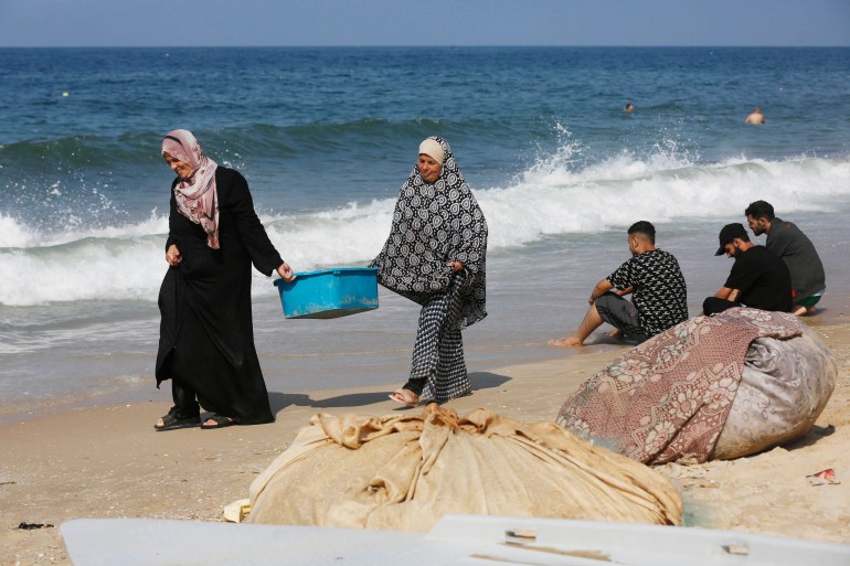 With no freshwater left, displaced Gaza families wash in polluted sea