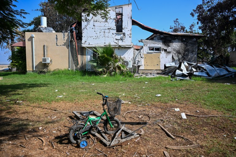 KISSUFIM, ISRAEL - NOVEMBER 01: A child's tricycle is seen left outside a partially destroyed house after Hamas militants attacked this kibbutz on October 7th near the border of Gaza, on November 01, 2023 in Kissufim, Israel. More than three weeks since Hamas's Oct 7 attacks in Israel, which killed 1,400 according to Israeli authorities, just over half have now been laid to rest, and over four-fifths have been identified. Volunteers continue to identify victims at the country's Shura military facility. (Photo by Alexi J. Rosenfeld/Getty Images)