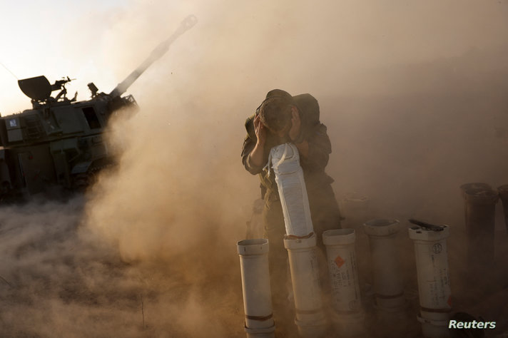 Israeli military units operate at an undisclosed location near the Gaza Strip border