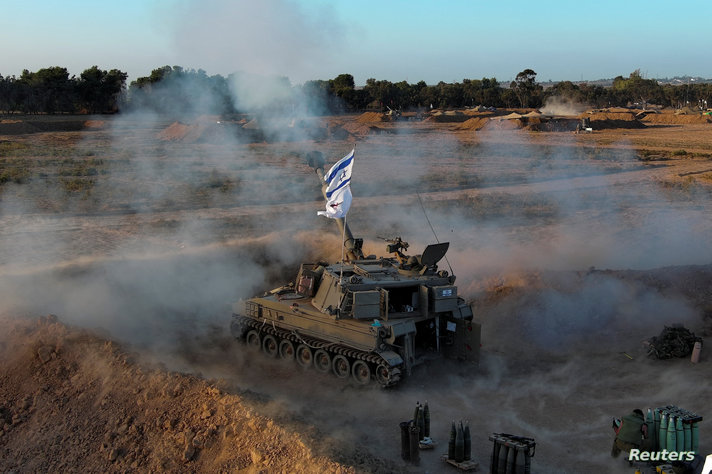 Israeli military units operate at an undisclosed location near the Gaza Strip border