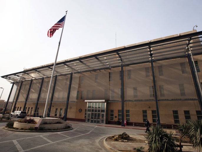 A U.S. flag flies in front of the Chancellery building inside the compound of the U.S. embassy in Baghdad December 14, 2011. The compound, located in Baghdad's Green Zone, will be the home for thousands of American citizens left after the U.S. military completes its withdrawal this month. REUTERS/Lucas Jackson (IRAQ - Tags: POLITICS CONFLICT MILITARY SOCIETY)