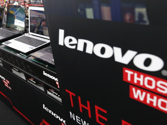 Lenovo's laptop PCs are displayed at an electronic shop in Tokyo September 5, 2012. Shares of PC maker Lenovo Group Ltd dropped as much as 8.1 percent on Wednesday after Japan's cash-strapped NEC Corp sold its entire stake in the company in a deal worth 18 billion yen ($229.62 million). REUTERS/Kim Kyung-Hoon (JAPAN - Tags: BUSINESS)