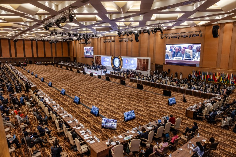 Heads of State and Government representatives attend the opening session of the Third South Summit of the Group of 77 and China (G77+China) in Kampala on January 21, 2024. - The G77+China is a coalition of developing countries designed to promote its member states economic interest and create negotiating capacity in the United Nations. (Photo by LUIS TATO / AFP)