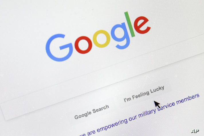 FILE - A cursor moves over Google's search engine page on Aug. 28, 2018, in Portland, Ore. Brazil’s Justice Ministry on Tuesday…