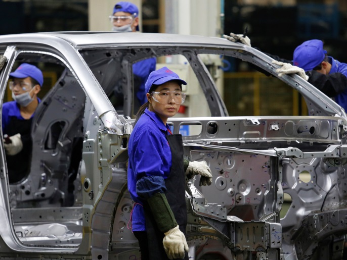 A worker looks on at a BYD assembly line in Shenzhen, China May 25, 2016. REUTERS/Bobby Yip/File Photo GLOBAL BUSINESS WEEK AHEAD PACKAGE - SEARCH