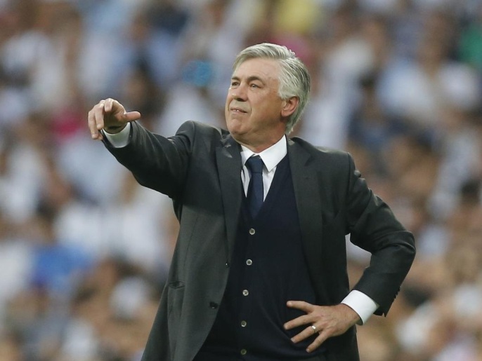 Real Madrid's coach Carlo Ancelotti gives directions to his players during the Champions League second leg semifinal soccer match between Real Madrid and Juventus, at the Santiago Bernabeu stadium in Madrid, Wednesday, May 13, 2015. (AP Photo/Daniel Ochoa de Olza)