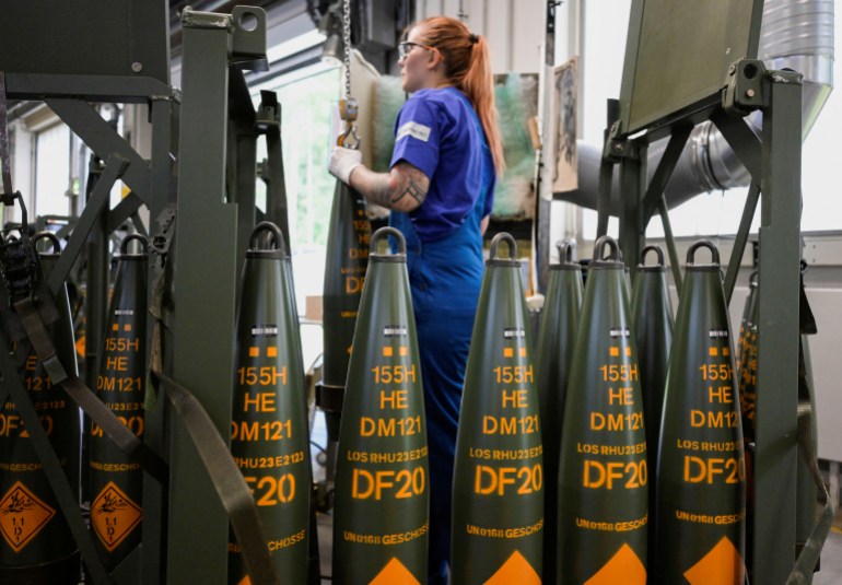 An employee works at a production line of 155 mm artillery shells at the plant of German company Rheinmetall, which produces weapons and ammunition for tanks and artillery, during a media tour in Unterluess, Germany, June 6, 2023. REUTERS/Fabian Bimmer