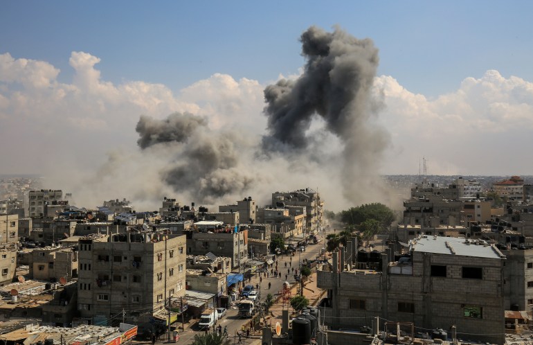 Smoke rises after Israeli air strikes of the city of Rafah in the southern Gaza Strip, October 10, 2023.