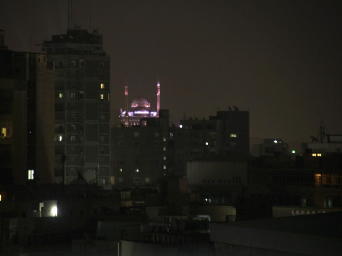 In this April 23, 2014 photo, lights decorate the ancient Mohammad Ali Pasha mosque in Cairo, Egypt during a power outage in the surrounding neigborhood. Rolling blackouts have already been hitting neighborhoods of Cairo daily throughout the winter, when electricity usage is lower. Now summer’s heat is coming, and Egypt’s crippling energy crisis is threatening to mount, creating an immediate political liability for the new president to be elected next month, expected to be former army chief Abdel-Fattah el-Sissi.(AP Photo/Amr Nabil)