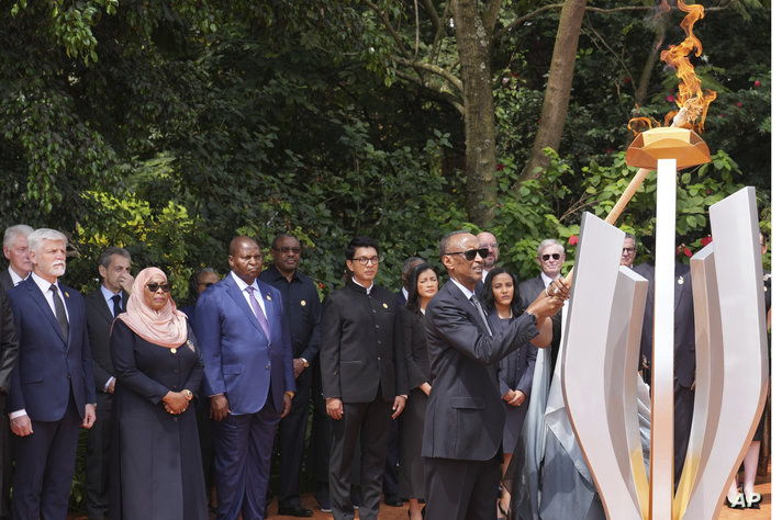 Rwandan President Paul Kagame lights a memorial flame during a ceremony to mark the 30th anniversary of the Rwandan genocide,…