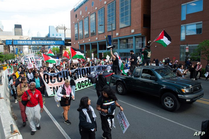 Students and faculty of Drexel University and University of Pennsylvania  march from City Hall to the University of…