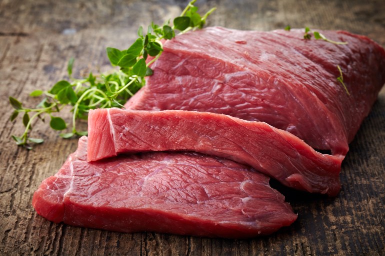 fresh raw meat on old wooden table