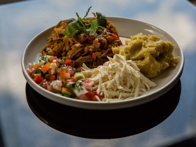 View of a plate of meatloaf made from shell of green banana, resulting in a vegetarian dish that ends up having the same appearance of the protein of beef after cutting the skin of the vegetable into thin strands, boiling water, stomp with a fork, and cook in a stir-fry, in the city of Caracas, Venezuela, 31 July 2016. People in Venuela are sharing easy ways to cook recepies with the available ingredients to overcome the food shortage that is hitting the country. The recepies are posted on a facebook group.