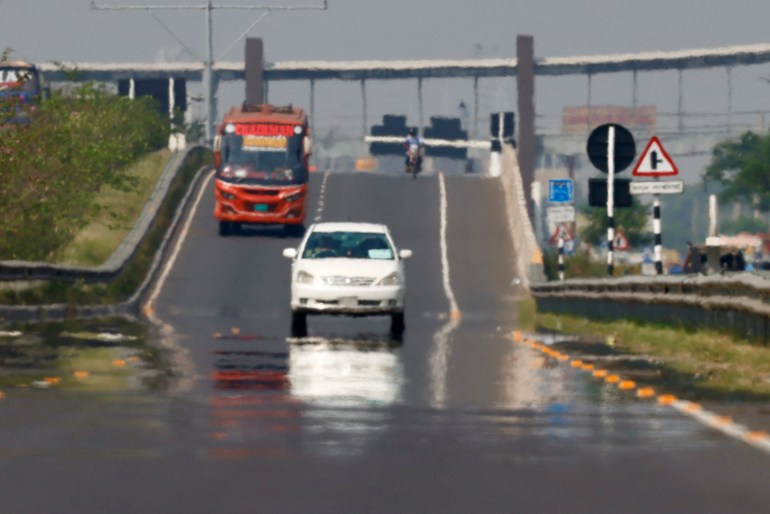 Heat mirage is visible on an expressway as vehicles move during a countrywide heat wave in Dhaka, Bangladesh, April 21, 2024xq. REUTERS/Mohammad Ponir Hossain