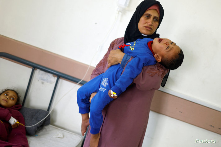 Palestinian children suffering from malnutrition receive treatment at al-Awda health centre, in Rafah, southern Gaza Strip