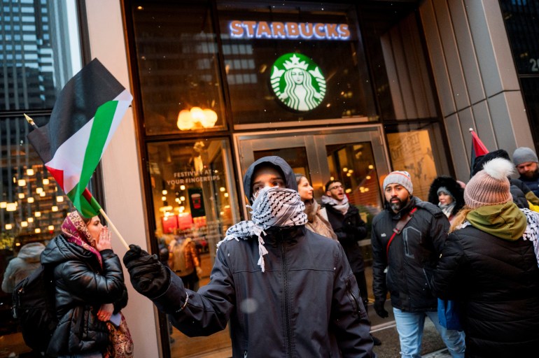 Activists of the group "Chicago Youth Liberation for Palestine" protest in support of Palestinians at a Starbucks, amid protests nationwide and calls for a ceasefire between Israel and Hamas, in Chicago, Illinois, U.S. December 31, 2023. REUTERS/Vincent Alban