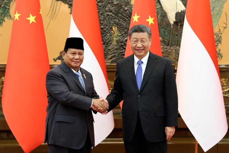 Chinese President Xi Jinping and Indonesia's President-elect Prabowo Subianto shake hands at the Great Hall of the People in Beijing, China April 1, 2024. China Daily via REUTERS ATTENTION EDITORS - THIS IMAGE WAS PROVIDED BY A THIRD PARTY. CHINA OUT.