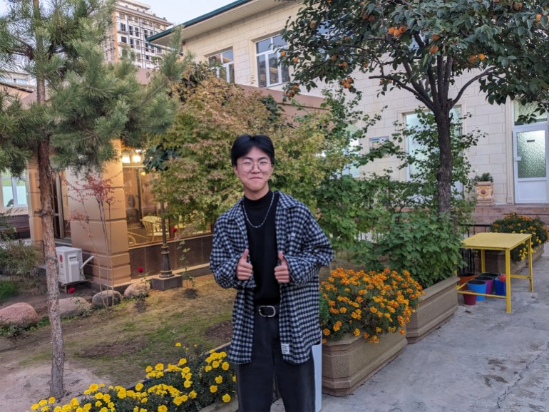 Kha Yudjin was born in Uzbekistan to a Koryo-saram family. He hopes to move to South Korea for his university studies, as do several of his friends [Ruairi Casey/Al Jazeera]