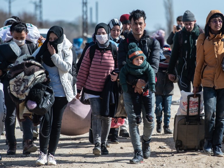 EDIRNE, TURKEY - MARCH 03: Refugees and migrants walk with their belongings to Turkey's Pazarkule border crossing with Greece's Kastanies on March 03, 2020 in Edirne, Turkey. Thousands of refugees and migrants have flocked to the Greece, Turkey border after Turkey announced that it would open border gates for a period of 72hrs to allow refugees to cross into European countries after thirty three Turkish soldiers were killed in a Syrian air raid in Idlib. (Photo by Bu