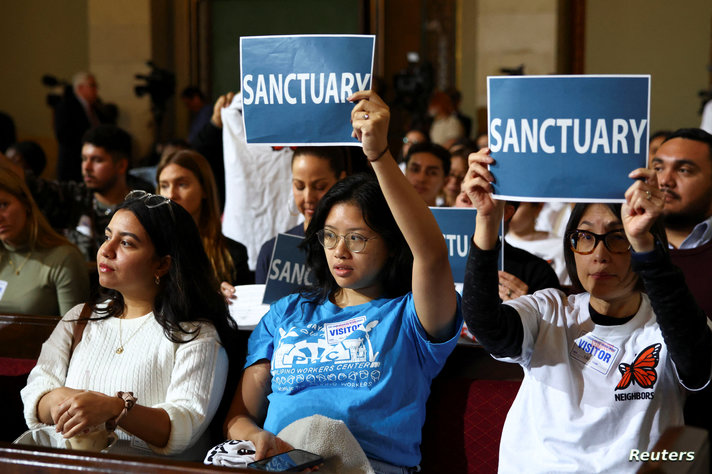 People attend a pro-immigration rally, in Los Angeles