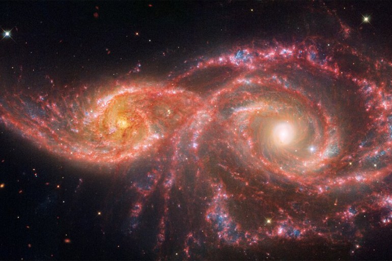 "Galaxies IC 2163 and NGC 2207 "المصدر (ناسا)