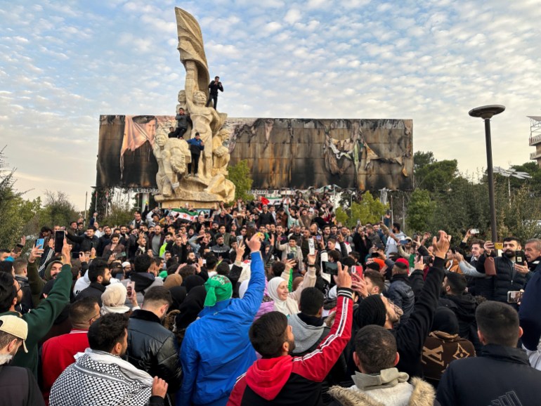 People gather at Saadallah al-Jabiri Square as they celebrate, after Syria's army command notified officers on Sunday that President Bashar al-Assad's 24-year authoritarian rule has ended, a Syrian officer who was informed of the move told Reuters, following a rapid rebel offensive that took the world by surprise, in Aleppo, Syria December 8, 2024. REUTERS/Karam al-Masri TPX IMAGES OF THE DAY