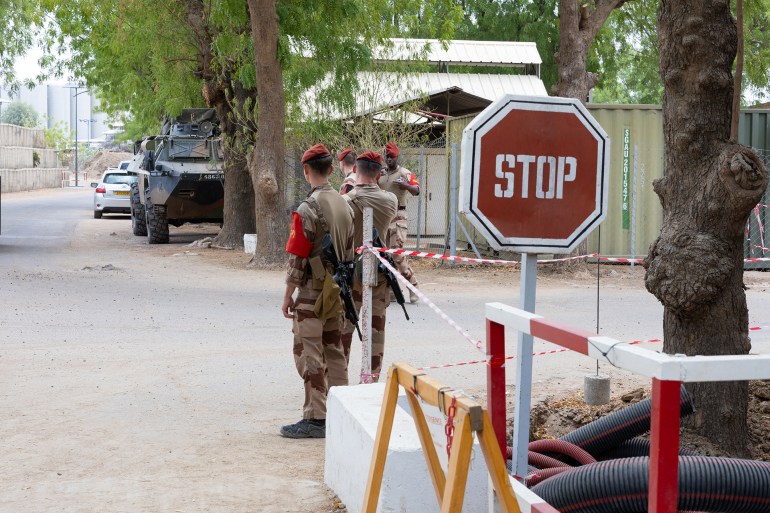 French soldiers guard the entrance to the Base Aerienne Projetee, also called air base 172 Chief Sergeant Adji Kossei, in N'Djamena on May 14, 2024. (Photo by Joris Bolomey / AFP)