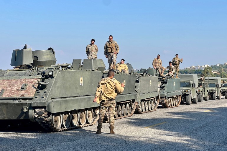 Lebanese army soldiers sit on their parked tanks along a road in the southern Lebanese coastal town of Naqura, on the border with Israel on January 7, 2025, after Israel's withdrawal from the area as part of the ceasefire agreement between the two countries. - Visiting US envoy Amos Hochstein said Israeli forces began withdrawing on January 6 from Naqura more than halfway into a fragile ceasefire between Israel and Hezbollah. It is the second such pullout since a November 27 ceasefire, and came after United Nations peacekeepers and Lebanon's prime minister late last month called on the Israeli army to speed up its withdrawal from Lebanon's south. (Photo by AFP)