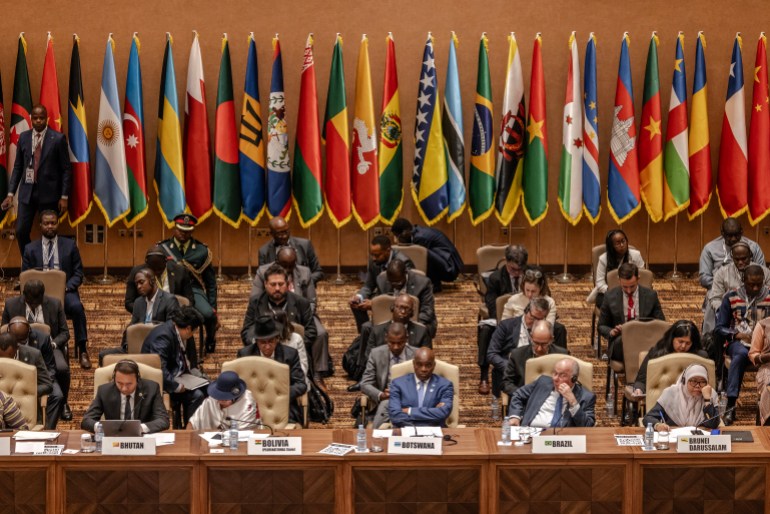 Delegates and Government representatives attend the opening session of the Third South Summit of the Group of 77 and China (G77+China) in Kampala on January 21, 2024. - The G77+China is a coalition of developing countries designed to promote its member states economic interest and create negotiating capacity in the United Nations. (Photo by LUIS TATO / AFP)