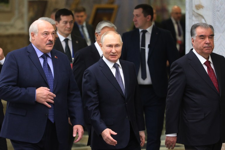 MINSK, BELARUS - NOVEMBER 23 (RUSSIA OUT) L-R: Belarussian President Alexander Lukashenko, Russian President Vladimir Putin and Tajik President Emomali Rakhmon enter the hall during the SCTO Summit on November 23, 2023, in Minsk, Belarus. Presidents of Russia, Belarus, Kazakhstan, Kyrgyzstan and Tajikistan gathered for the Collective Security Council Treaty Organization (SCTO) Summit in Minsk. (Photo by Contributor/Getty Images)