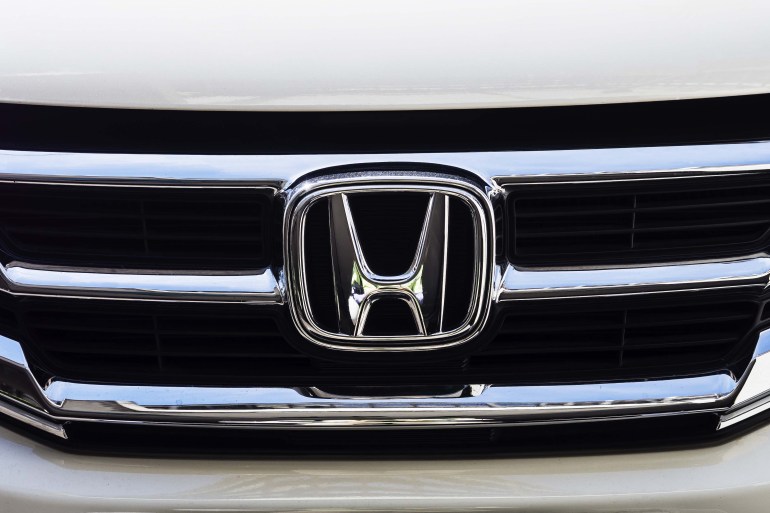 BANGKOK - AUGUST 23, 2014: Logo of Honda car in use on Bangkok, Thailand. Honda is a Japanese public multinational corporation and manufacturer of automobiles.; Shutterstock ID 214834939; purchase_order: aljazeera ; job: ; client: ; other: