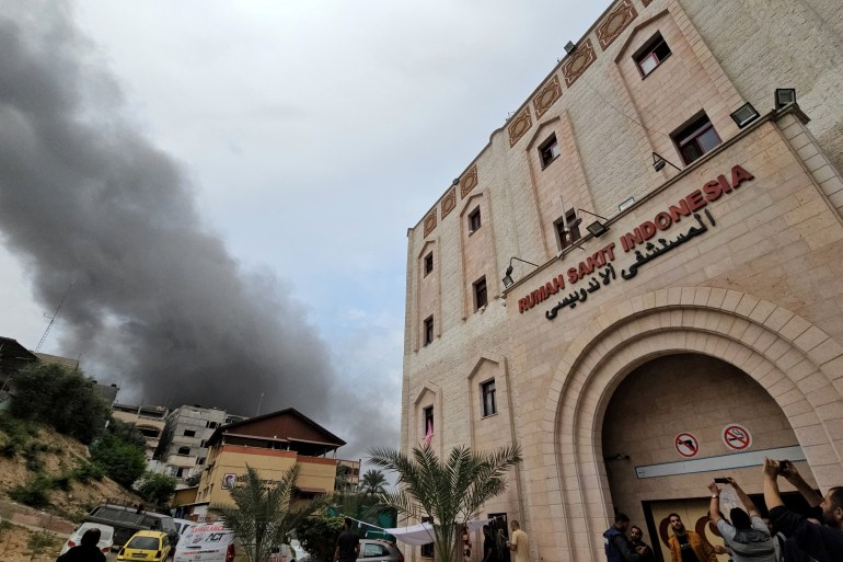 Smoke rises following an Israeli strike near the Indonesian Hospital that ran out of fuel and electricity, in the northern Gaza Strip, November 12, 2023. REUTERS/Anas al-Shareef