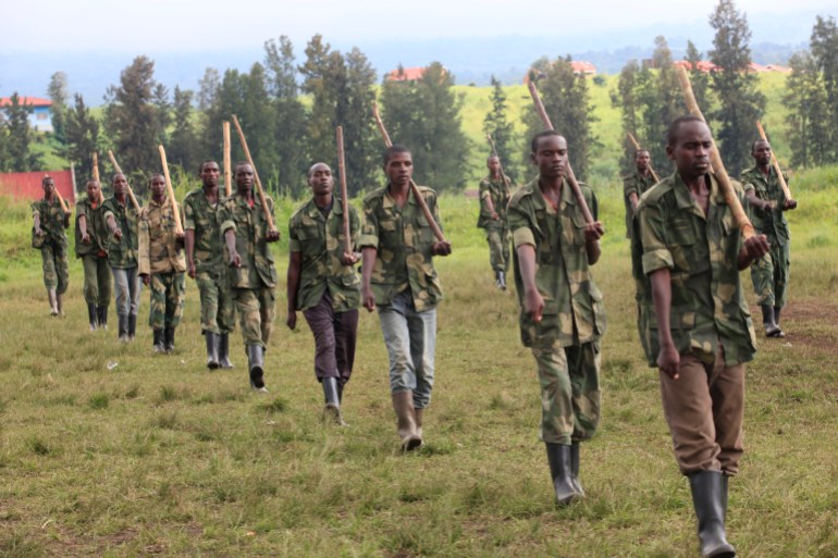 Recruits of the newly formed Congolese Revolutionary Army march during military training in Rumangabo military camp, Democratic Republic of Congo, October 23, 2012. The M23 Movement, the newly formed political wing of former M23 rebels, has formed a semi autonomous administration structure in areas under their control in north Kivu province in the DRC. REUTERS/James Akena (DEMOCRATIC REPUBLIC CONGO - Tags: CIVIL UNREST POLITICS CONFLICT)