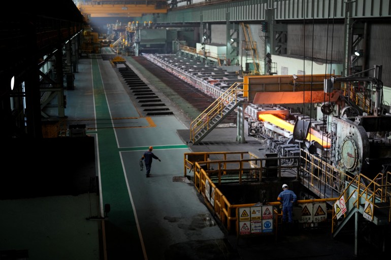 Employees work at a hot rolling plant during a government-organised media tour to Baoshan Iron & Steel Co., Ltd. (Baosteel), a subsidiary of China Baowu Steel Group, in Shanghai, China September 16, 2022. REUTERS/Aly Song