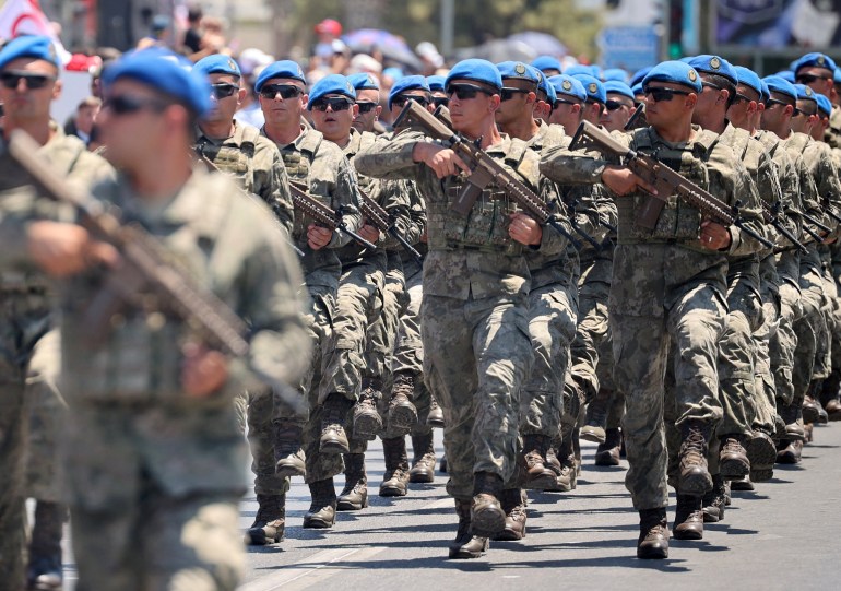 Turkish soldiers march during a military parade to mark the 1974 Turkish invasion of Cyprus in response to a short-lived Greek-inspired coup, in the Turkish-controlled northern Cyprus, in the divided city of Nicosia, Cyprus July 20, 2024. REUTERS/Yiannis Kourtoglou