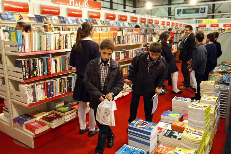 Lebanese students visit the 52nd Arab and International Beirut Book Fair in the Lebanese capital on November 28, 2008. More than 150 Lebanese and 30 Arab publishing houses are taking part in the annual exhibition. AFP PHOTO/RAMZI HAIDAR (Photo credit should read RAMZI HAIDAR/AFP via Getty Images)