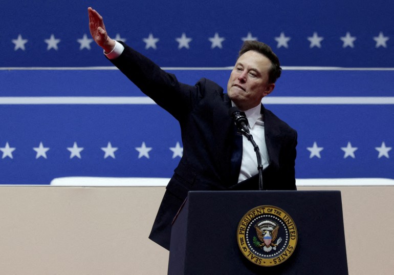 FILE PHOTO: Elon Musk gestures at the podium inside the Capital One arena on the inauguration day of Donald Trump's second presidential term, in Washington, U.S., January 20, 2025. REUTERS/Mike Segar/File Photo