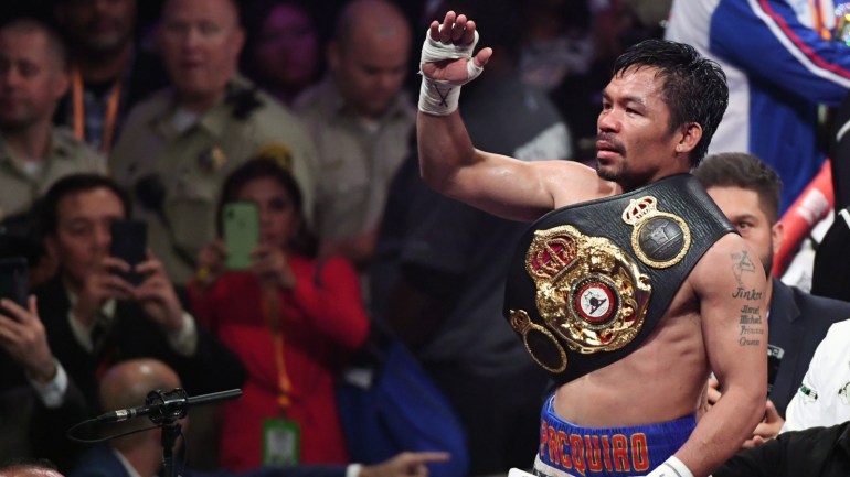 LAS VEGAS, NEVADA - JULY 20: Manny Pacquiao celebrates his split-decision victory over Keith Thurman in their WBA welterweight title fight at MGM Grand Garden Arena on July 20, 2019 in Las Vegas, Nevada. Ethan Miller/Getty Images/AFP== FOR NEWSPAPERS, INTERNET, TELCOS & TELEVISION USE ONLY ==