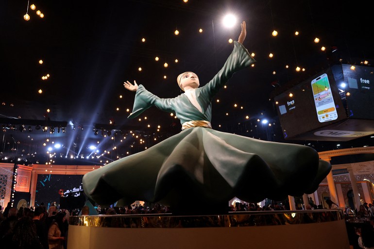 The audience cheers during the taping of the ìAkram Men Minî program, which airs on the LBCI channel during the Muslim holy fasting month of Ramadan, in Beirut on March 21, 2025. (Photo by ANWAR AMRO / AFP)